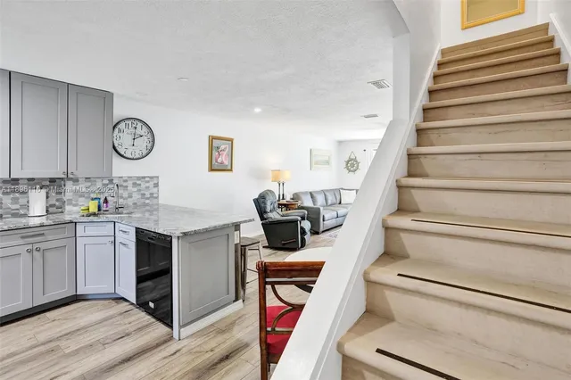 a view of cabinets and wooden floor