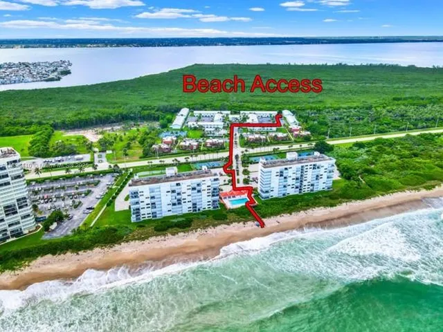 a sign board with a play ground in the back