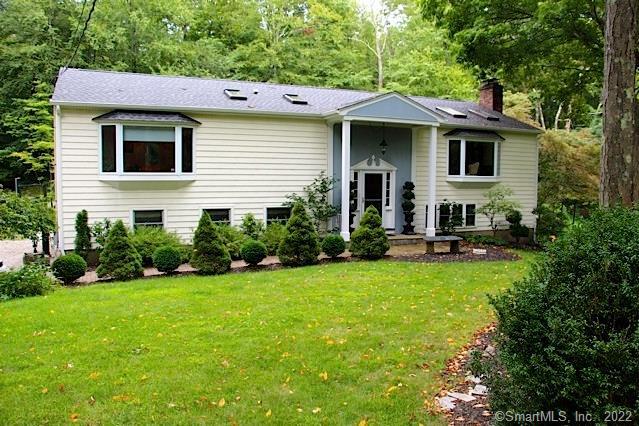 29 St Johns Road Wilton, CT 06897 - Photo 1 of 1 a view of a house with a yard and sitting area