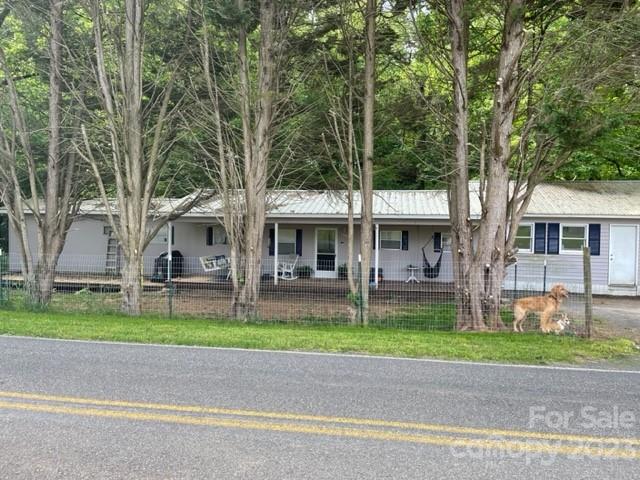 2363 Coley Pond Road Newton, NC 28658 - Photo 1 of 17 a front view of a house with a garden and trees