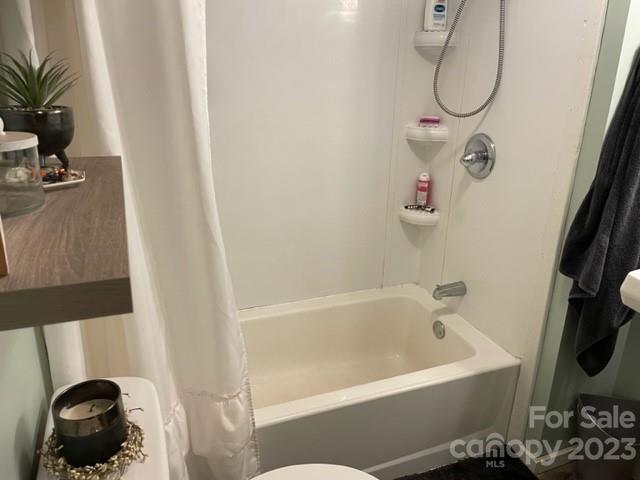 2363 Coley Pond Road Newton, NC 28658 - Photo 11 of 17 a bathroom with a bath tub and a shower
