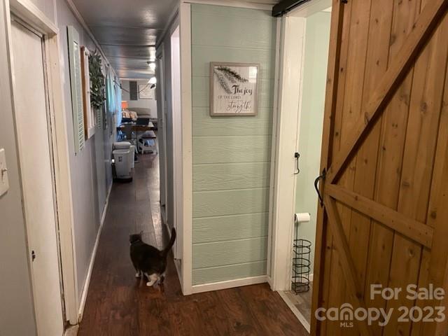 2363 Coley Pond Road Newton, NC 28658 - Photo 13 of 17 a view of a hallway with wooden floor and staircase