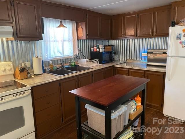 2363 Coley Pond Road Newton, NC 28658 - Photo 7 of 17 a kitchen with a sink stove and cabinets