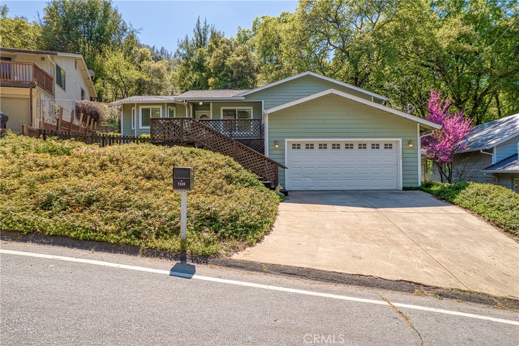 7300 Evergreen Drive Kelseyville, CA 95451 - Photo 1 of 41 a view of a house with a yard and garage