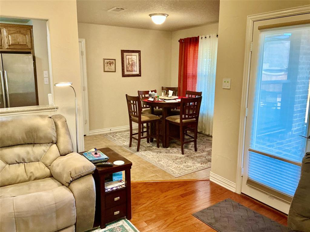 312 McAfee Street Mabank, TX 75147 - Photo 31 of 40 a living room with furniture and wooden floor