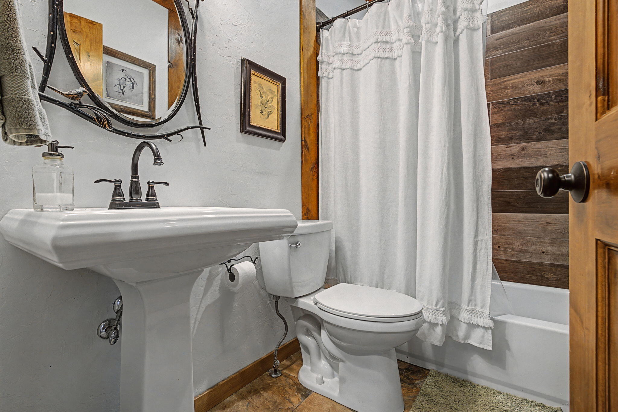 213 Big Canyon Point Ridgway, CO 81432 - Photo 18 of 41 a bathroom with a sink a mirror a toilet and a mirror