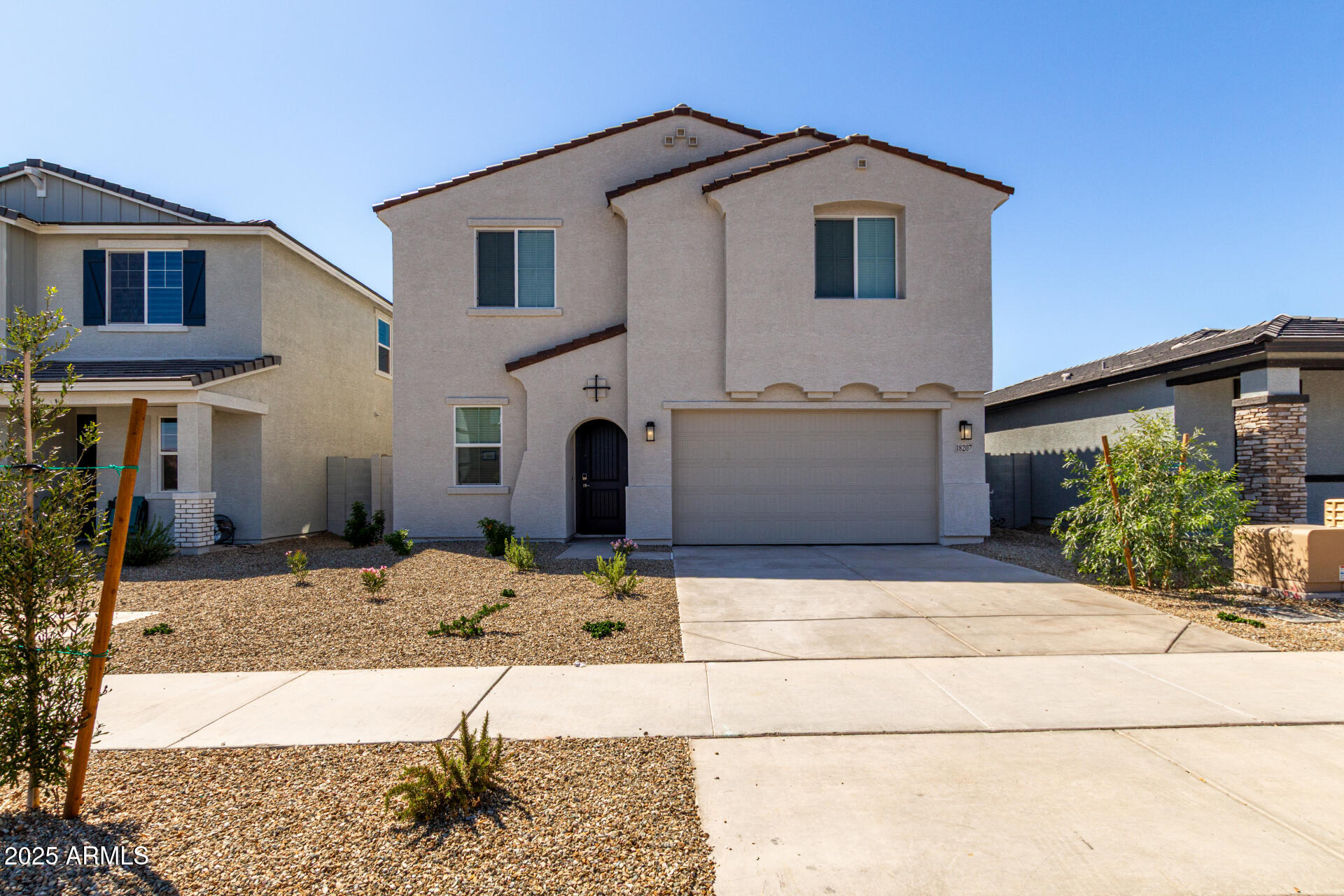 a front view of a house with garage