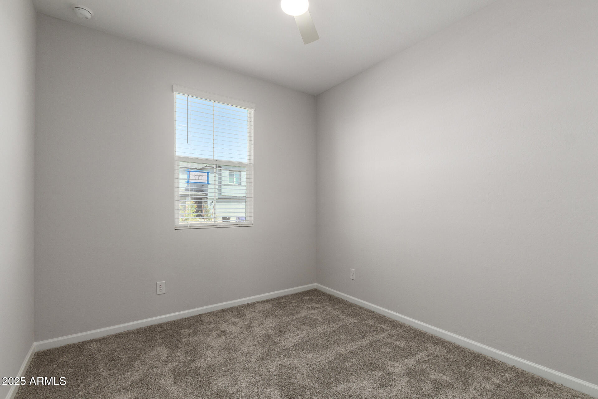 18207 West Daley Lane Surprise, AZ 85387 - Photo 16 of 40 an empty room with a window