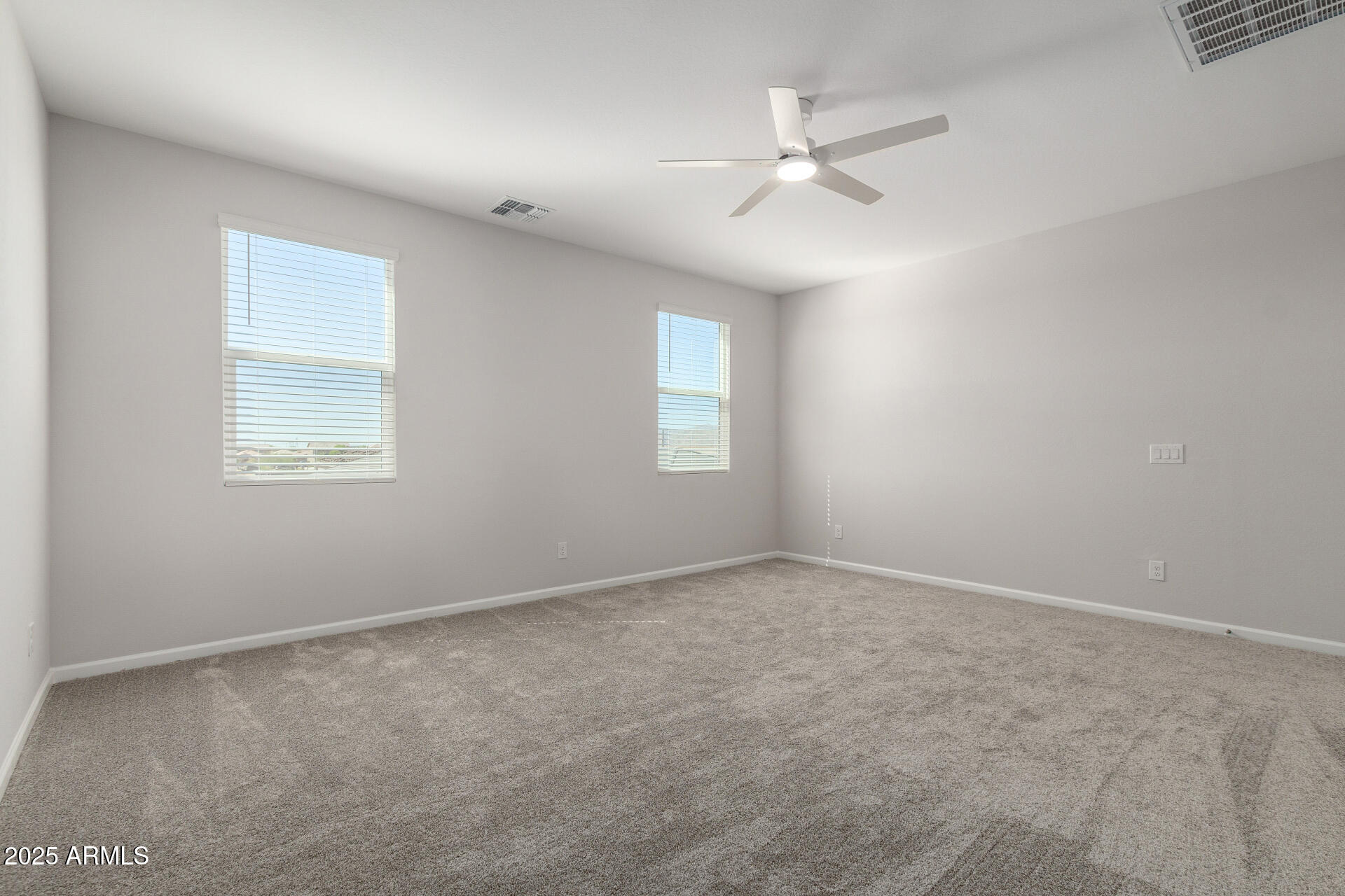 18207 West Daley Lane Surprise, AZ 85387 - Photo 25 of 40 a view of an empty room with a window