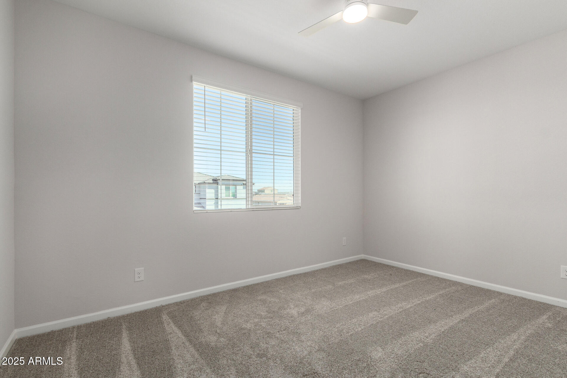 18207 West Daley Lane Surprise, AZ 85387 - Photo 29 of 40 an empty room with a window