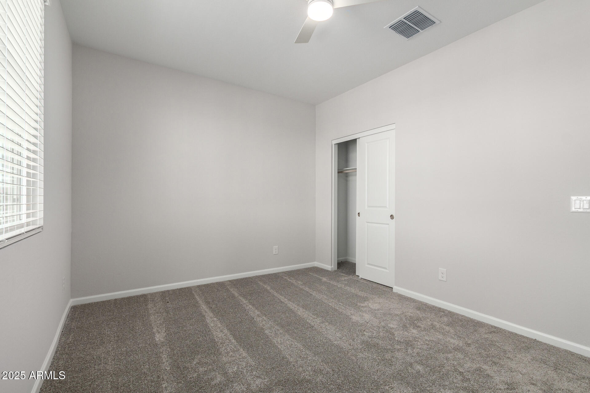 18207 West Daley Lane Surprise, AZ 85387 - Photo 30 of 40 an empty room with a window