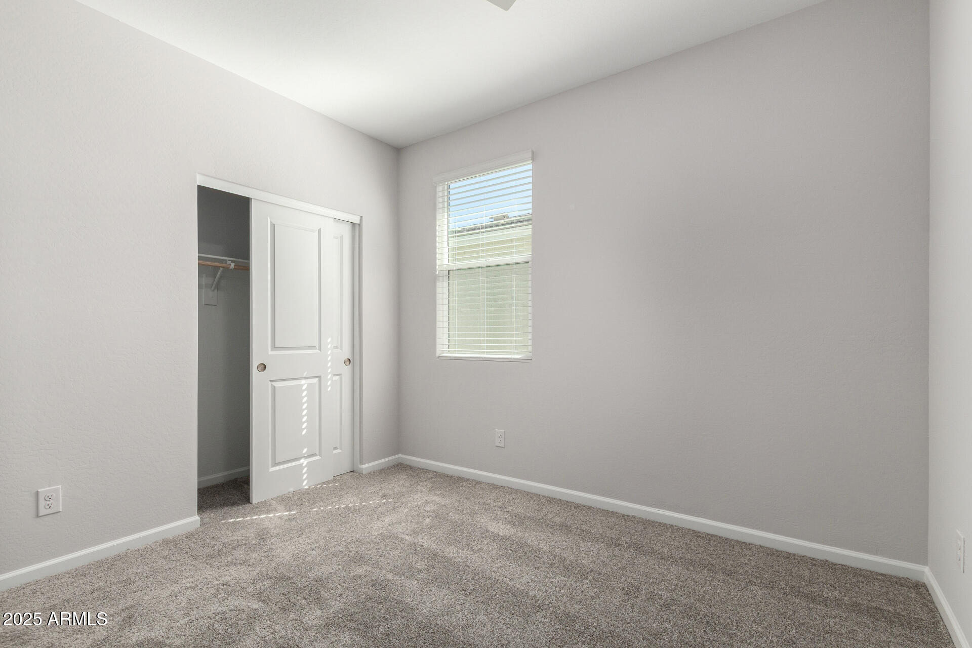 18207 West Daley Lane Surprise, AZ 85387 - Photo 32 of 40 an empty room with windows