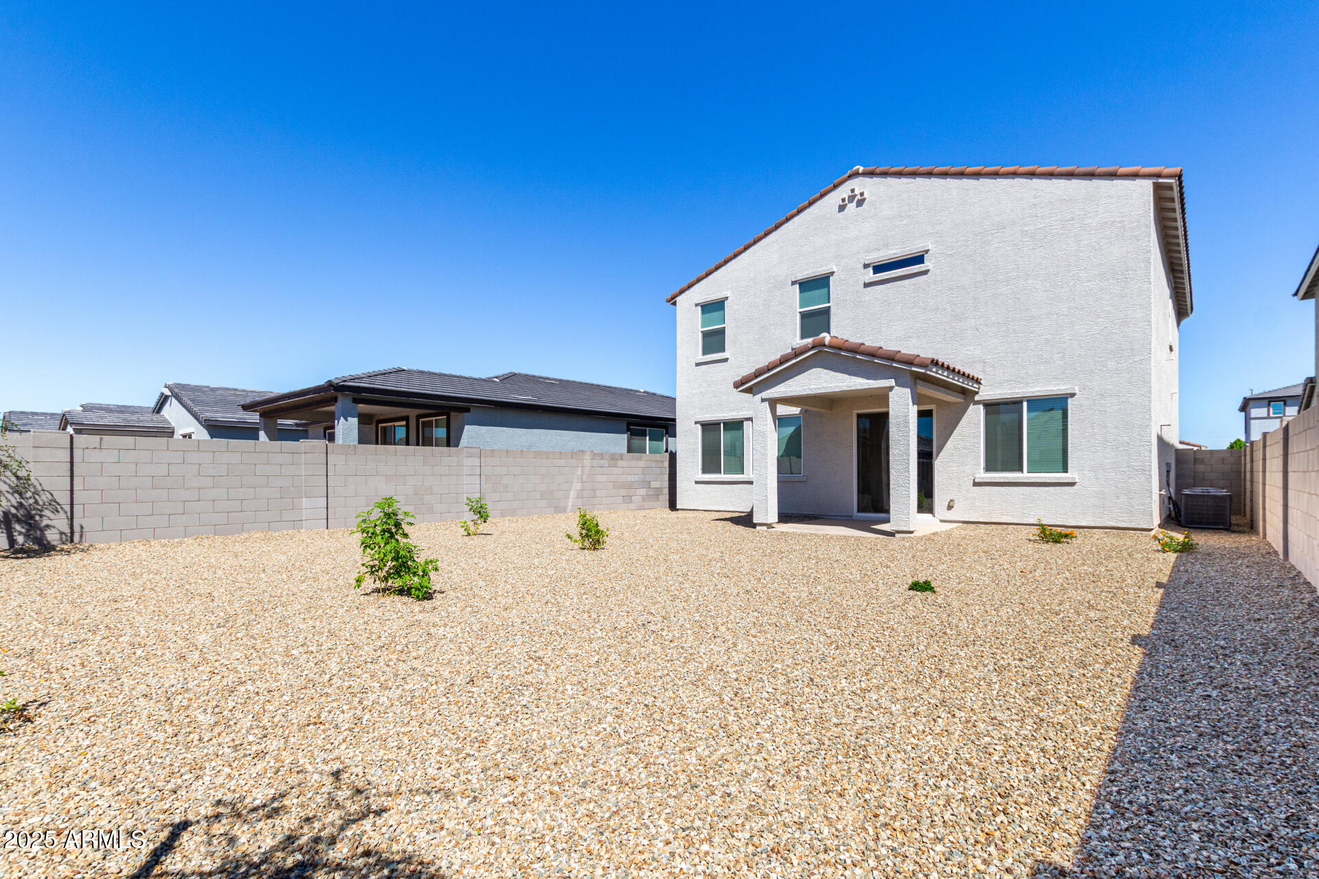 18207 West Daley Lane Surprise, AZ 85387 - Photo 38 of 40 a front view of a house with a yard