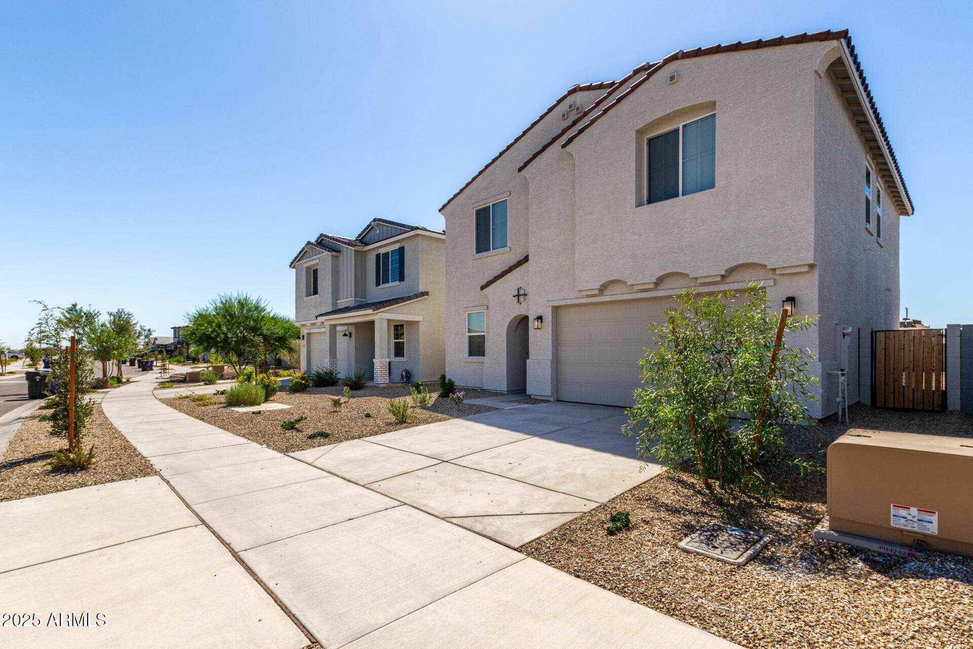 18207 West Daley Lane Surprise, AZ 85387 - Photo 5 of 40 a view of a white house with a yard