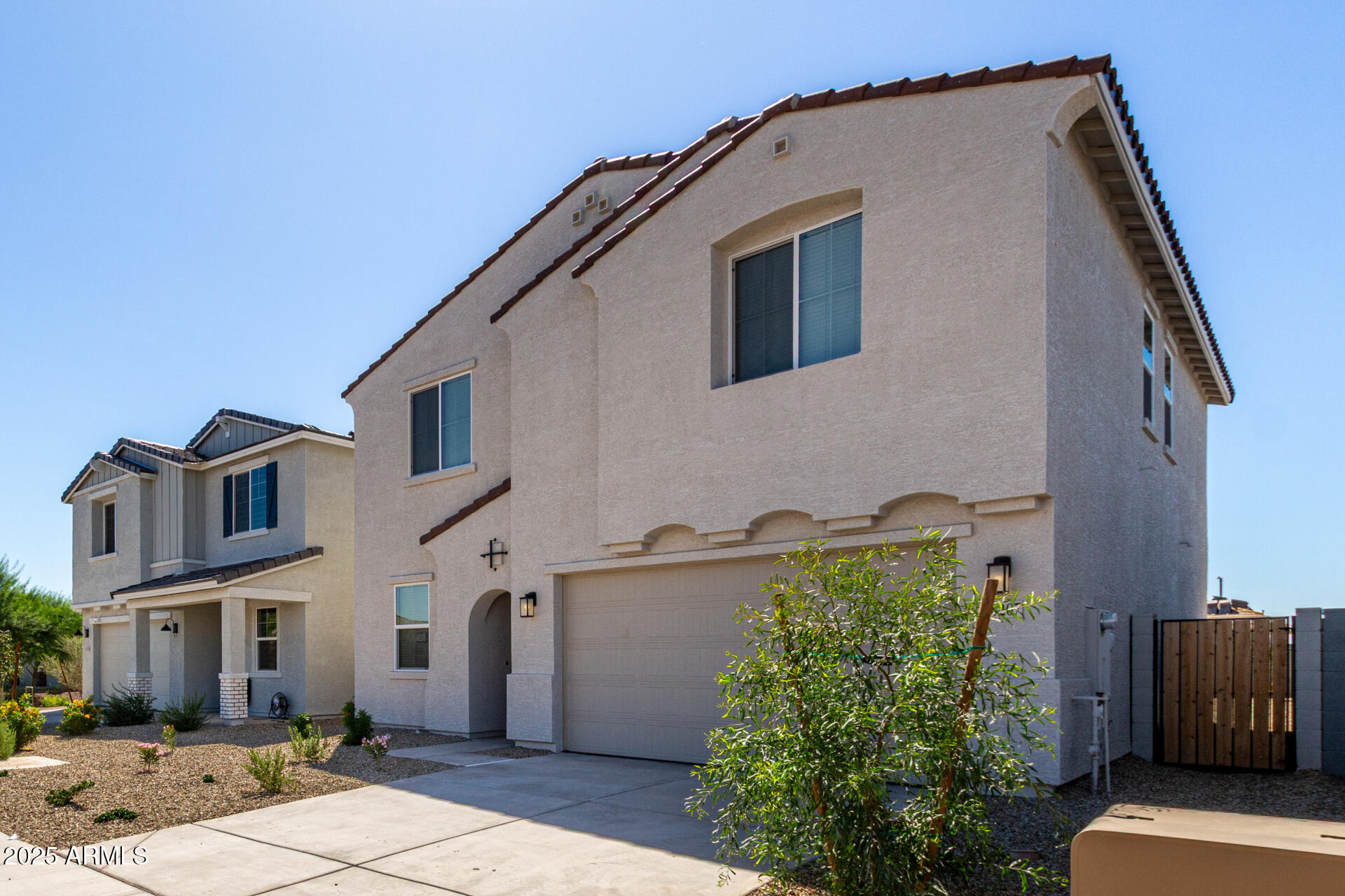 18207 West Daley Lane Surprise, AZ 85387 - Photo 6 of 40 a front view of a house with plants