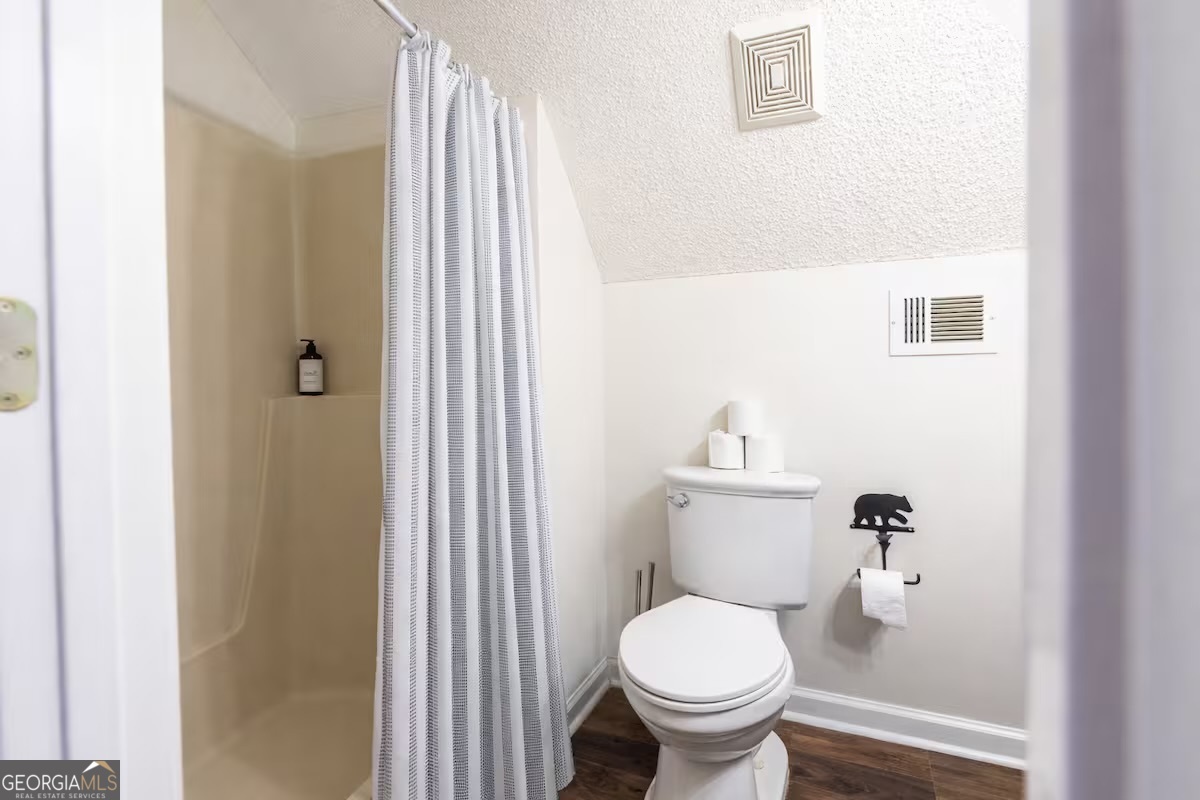 68 Franklin Road Eatonton, GA 31024 - Photo 26 of 28 a white toilet sitting next to a bathroom sink