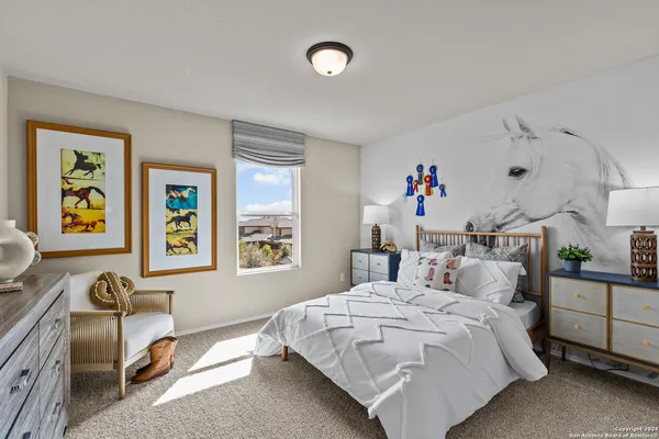 a bedroom with furniture and a couch