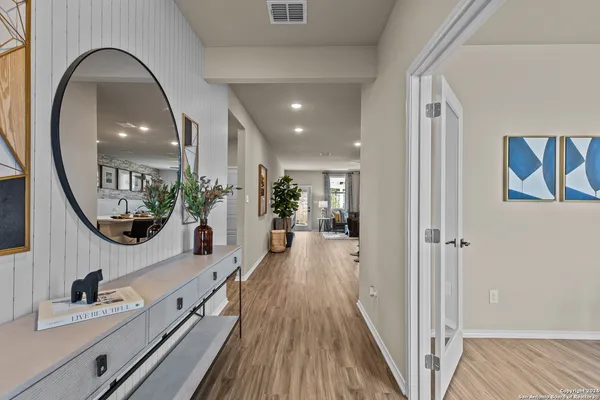 workspace with wooden floor and mirror