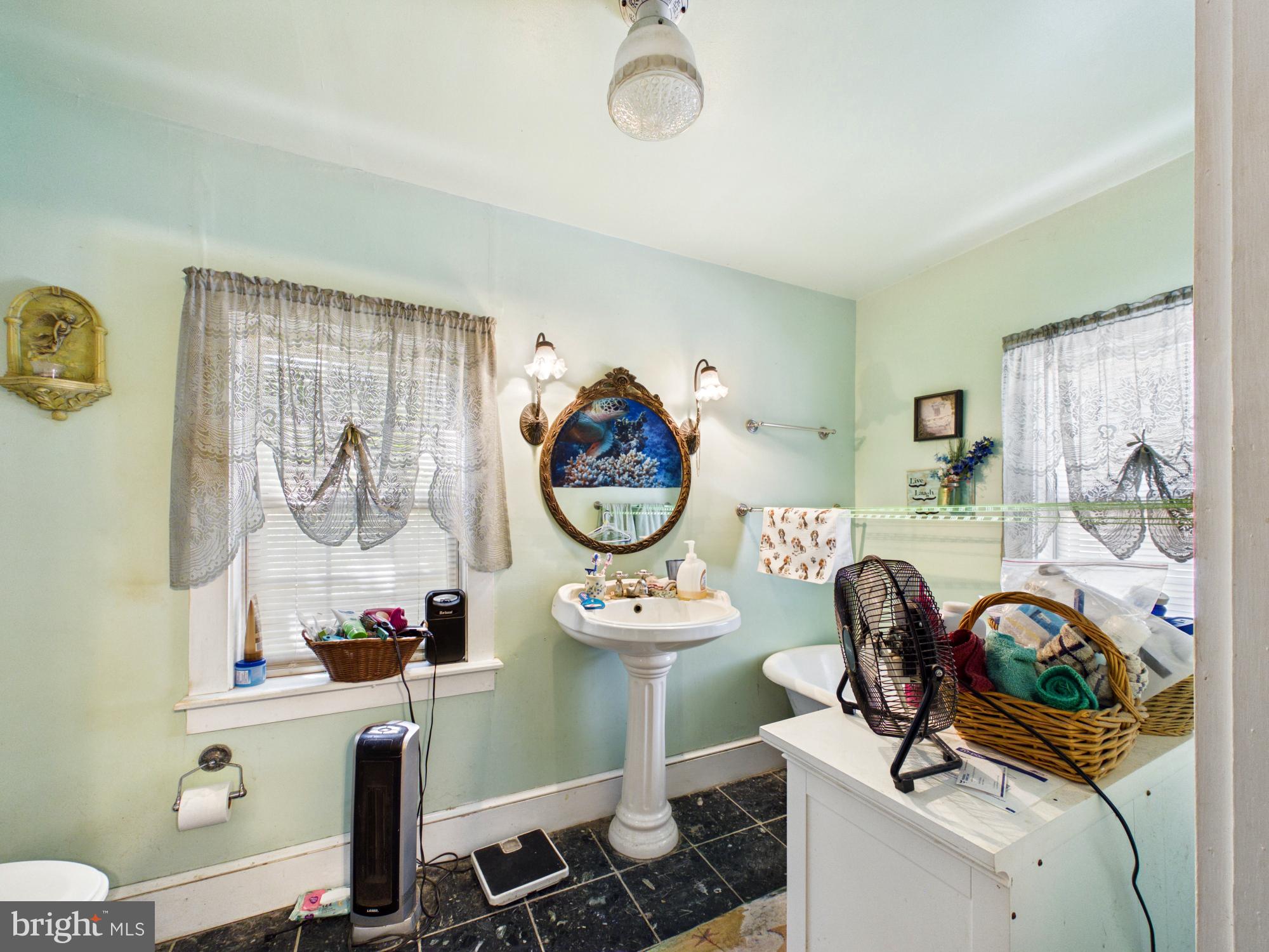 20488 Nanticoke Road Nanticoke, MD 21840 - Photo 19 of 32 Charming vintage bathroom retreat.
