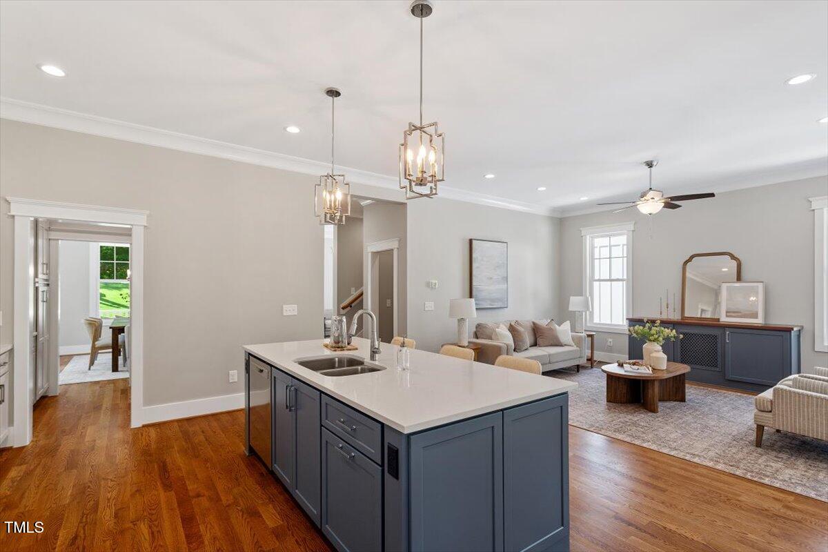 3932 Old Chapel Hill Road Durham, NC 27707 - Photo 17 of 46 a kitchen with a sink appliances and wooden floor