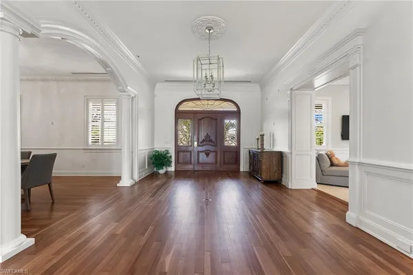a view of a living room and wooden floor