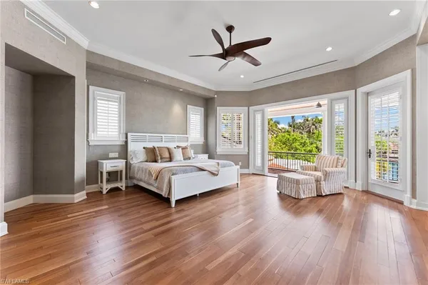 a living room with furniture and a dresser