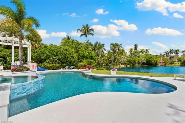 a view of a swimming pool and a yard