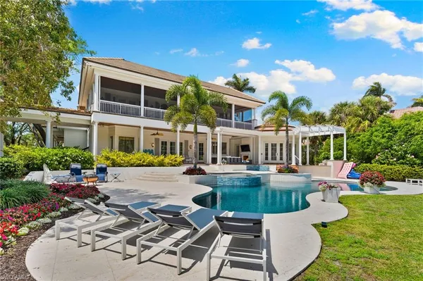 a view of a swimming pool with a sitting space