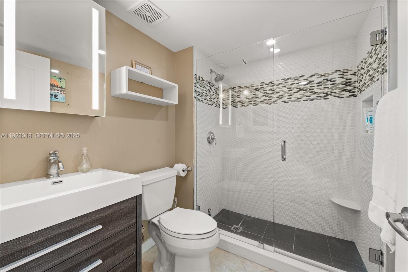 1900 Sunset Harbour Drive, Unit 2115 Miami Beach, FL 33139 - Photo 15 of 25 a bathroom with a sink toilet and shower