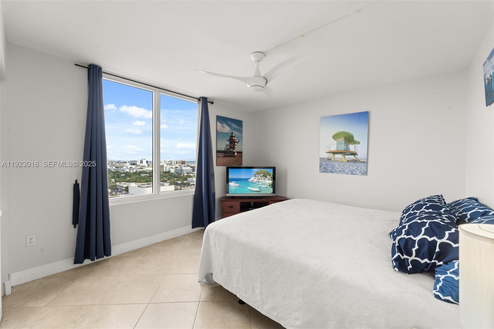 1900 Sunset Harbour Drive, Unit 2115 Miami Beach, FL 33139 - Photo 16 of 25 a bedroom with a bed and a large window