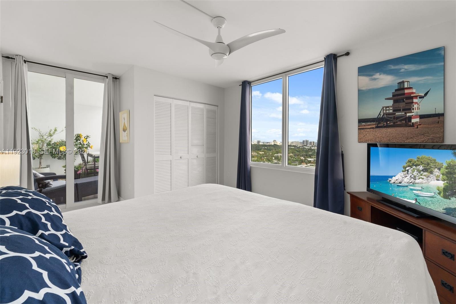 1900 Sunset Harbour Drive, Unit 2115 Miami Beach, FL 33139 - Photo 17 of 25 a bedroom with a large bed and a window