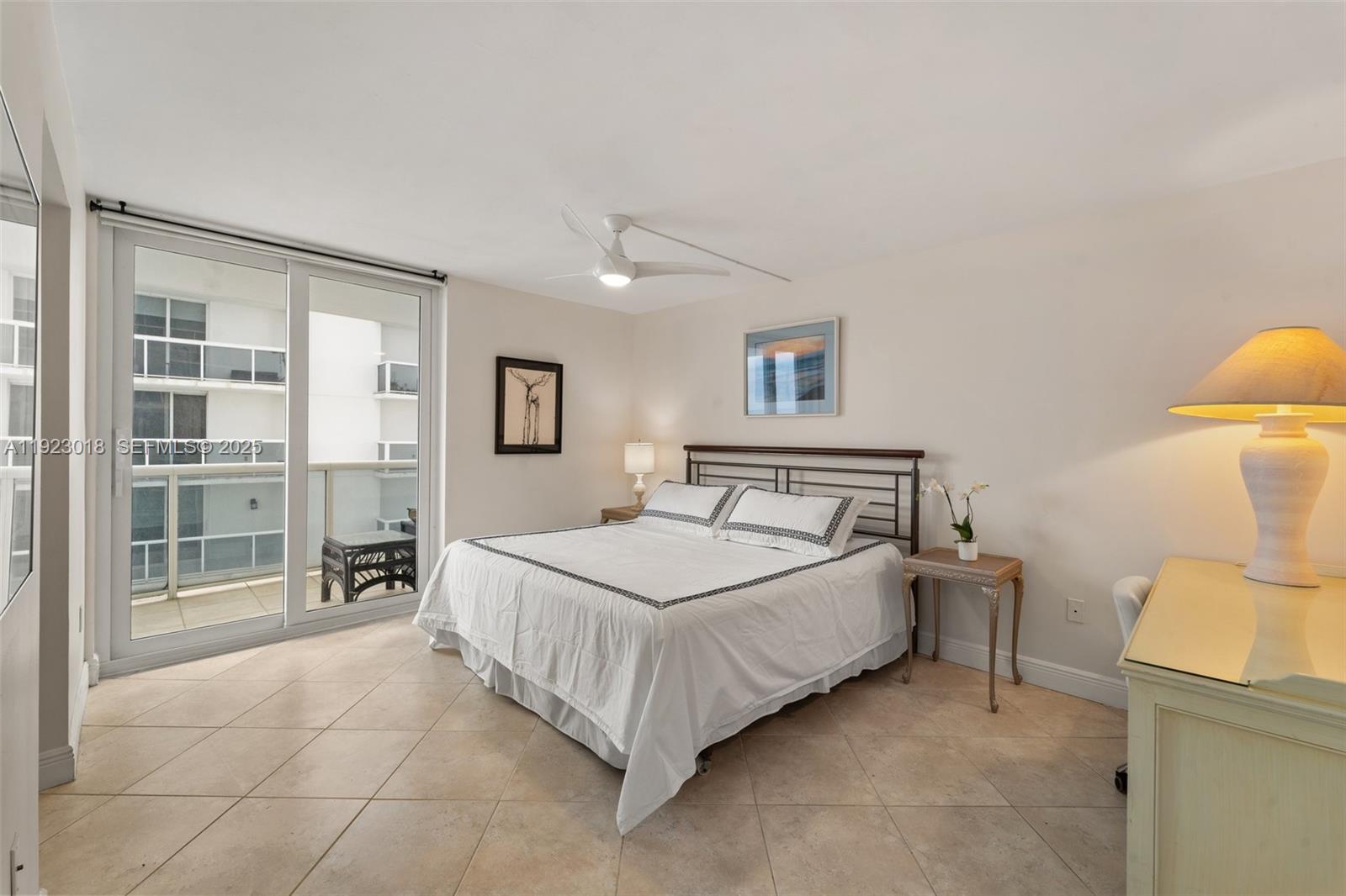 1900 Sunset Harbour Drive, Unit 2115 Miami Beach, FL 33139 - Photo 24 of 25 a bedroom with a bed and a large window