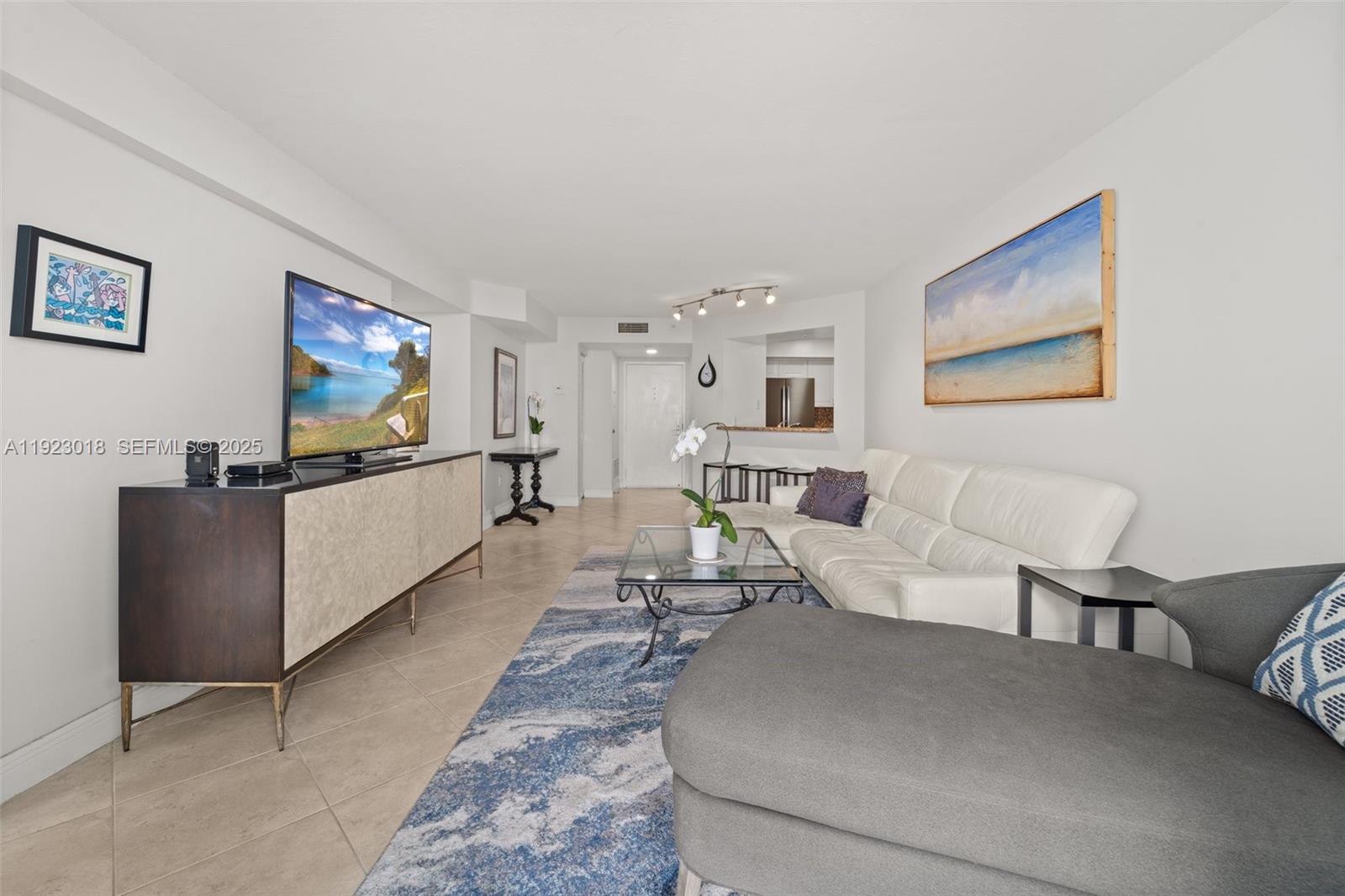 1900 Sunset Harbour Drive, Unit 2115 Miami Beach, FL 33139 - Photo 10 of 25 a living room with furniture and a flat screen tv