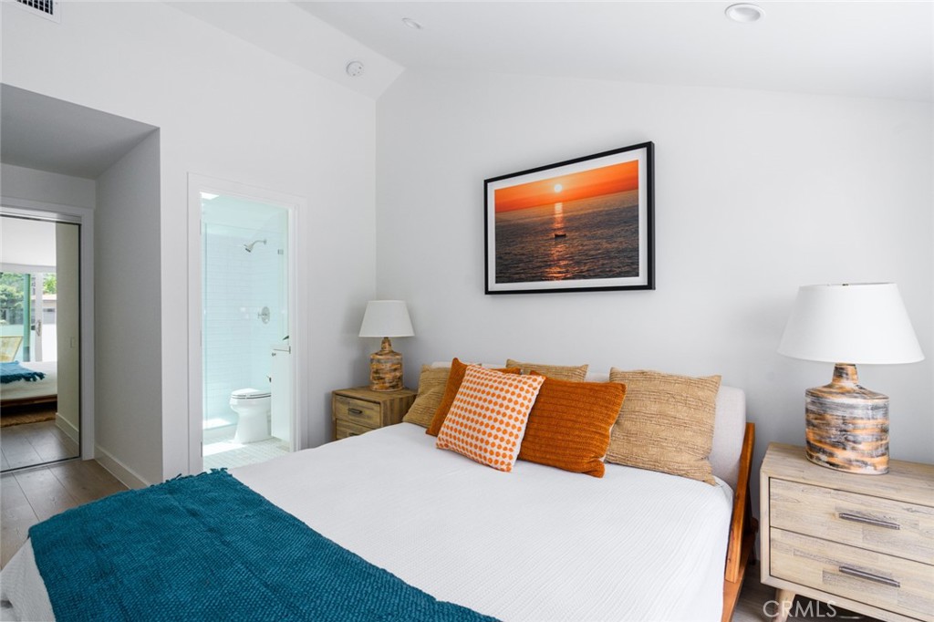 478 Morning Canyon Road Corona del Mar, CA 92625 - Photo 13 of 23 a bedroom with a bed and a lamp on dresser