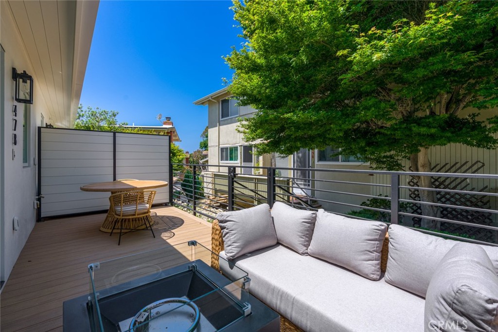 478 Morning Canyon Road Corona del Mar, CA 92625 - Photo 16 of 23 a view of a deck with couches chairs with wooden floor