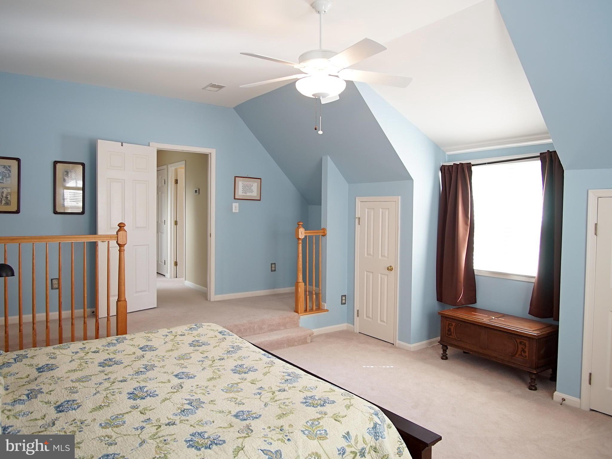 227 Midsummer Circle Gaithersburg, MD 20878 - Photo 11 of 25 a bedroom with a bed closet and a large mirror