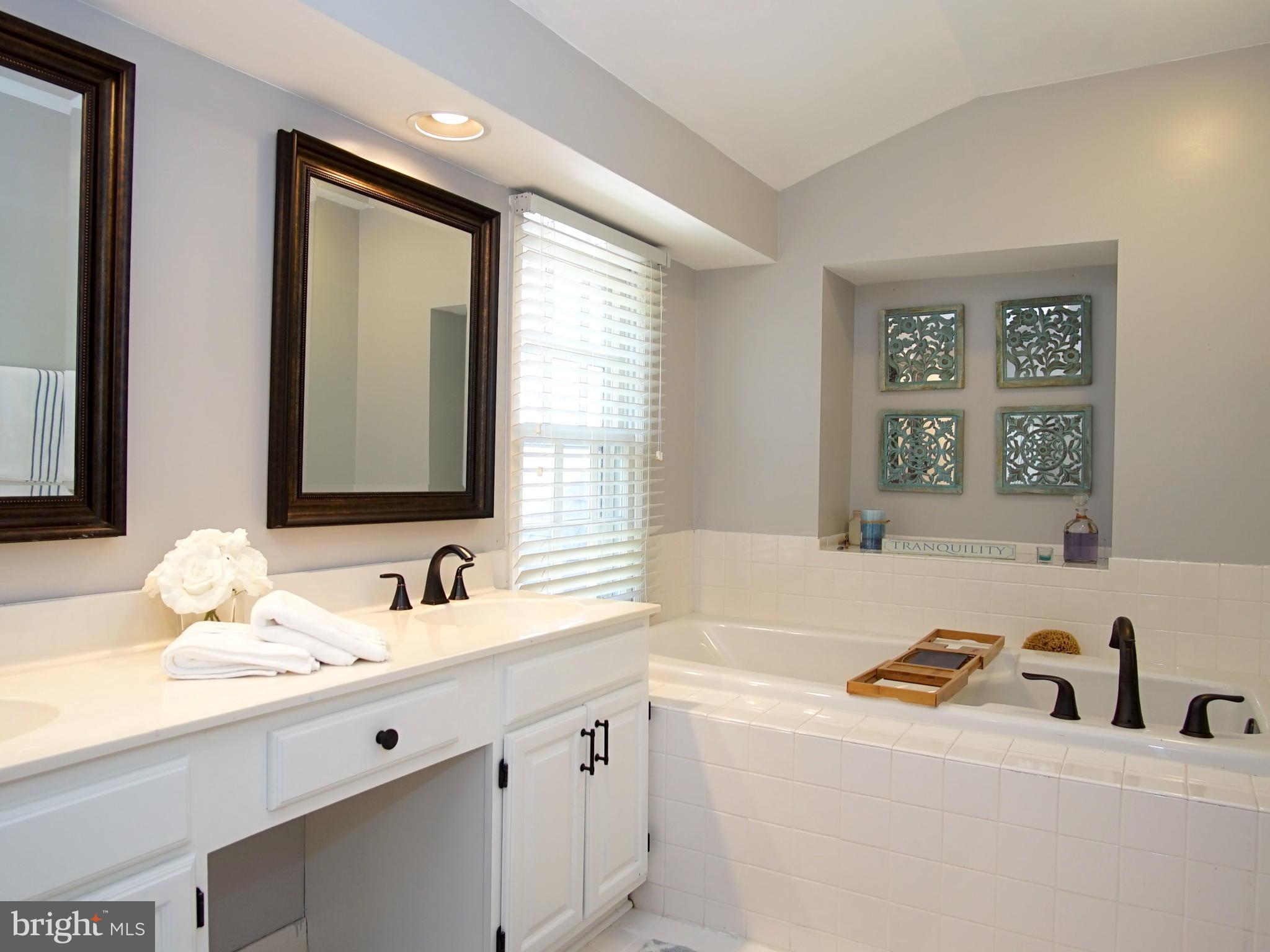 227 Midsummer Circle Gaithersburg, MD 20878 - Photo 12 of 25 a bathroom with a sink and a mirror
