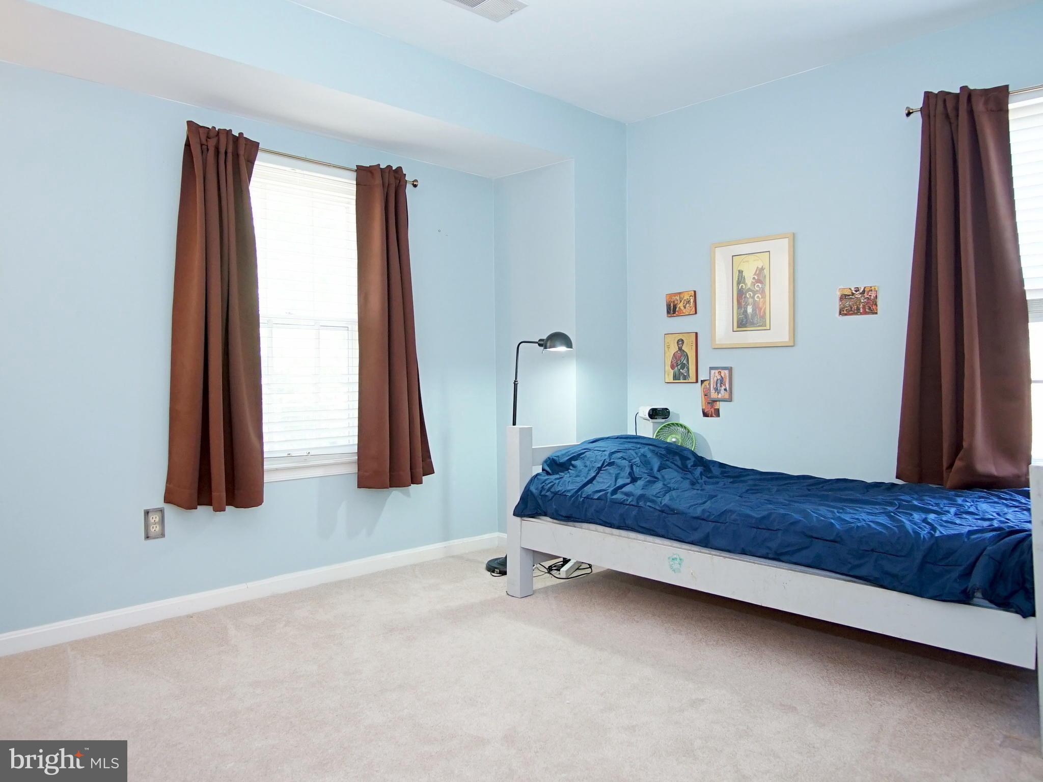 227 Midsummer Circle Gaithersburg, MD 20878 - Photo 14 of 25 a bedroom with a bed and a window