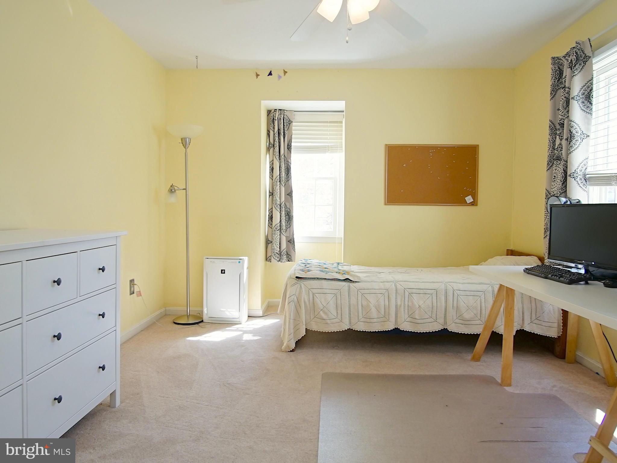 227 Midsummer Circle Gaithersburg, MD 20878 - Photo 16 of 25 a bed room with a bed and a night stand