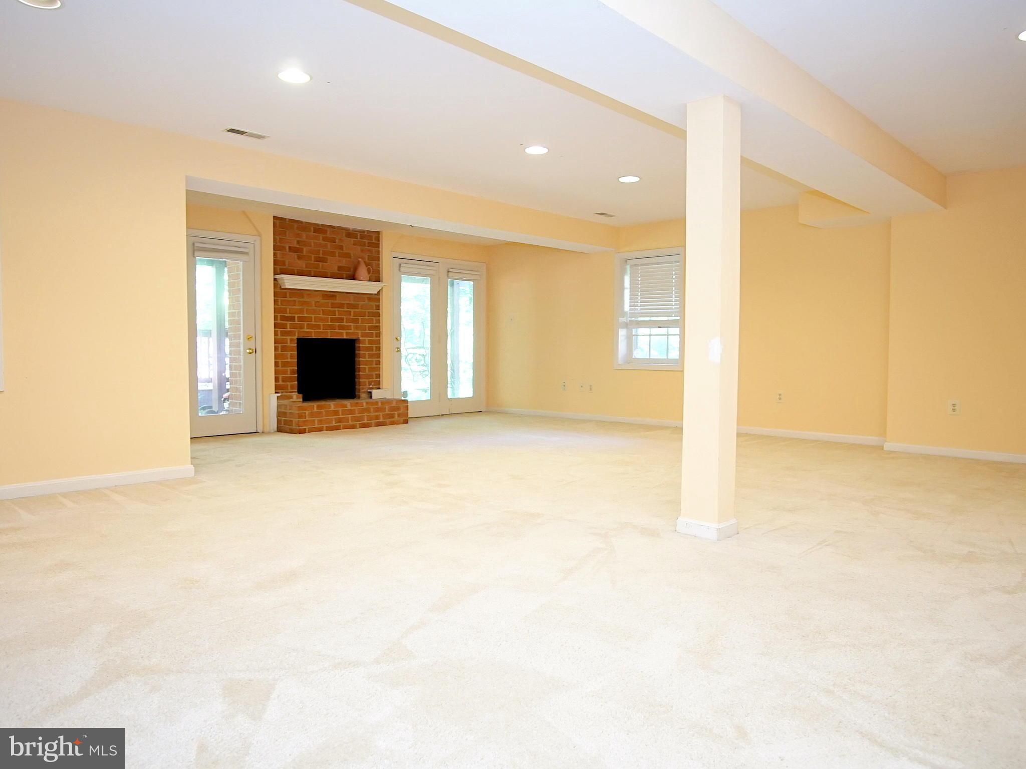 227 Midsummer Circle Gaithersburg, MD 20878 - Photo 20 of 25 a view of an empty room with a fireplace