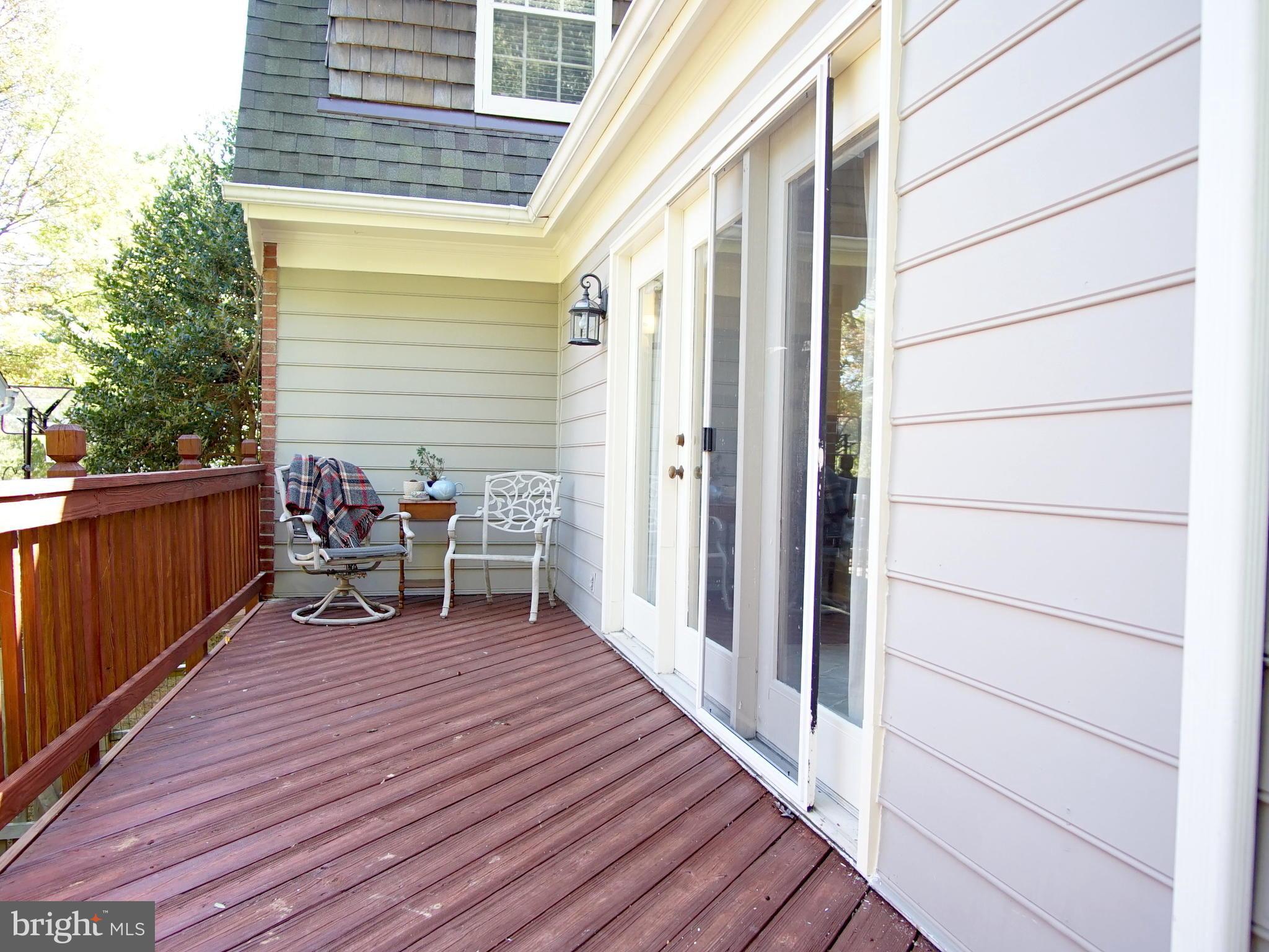227 Midsummer Circle Gaithersburg, MD 20878 - Photo 23 of 25 a view of a deck with wooden floor and seating space