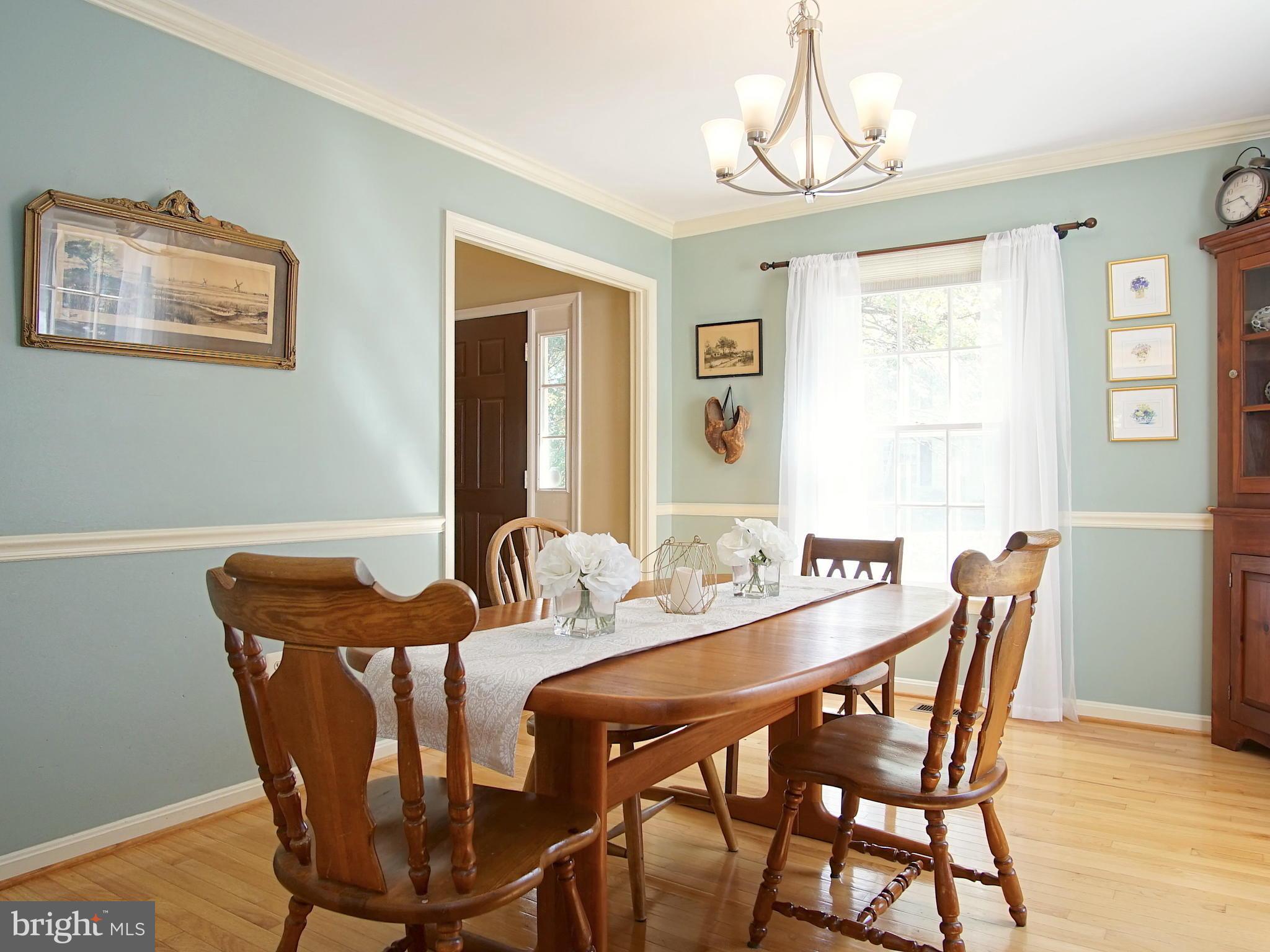 227 Midsummer Circle Gaithersburg, MD 20878 - Photo 4 of 25 a view of a dining room with furniture window and wooden floor