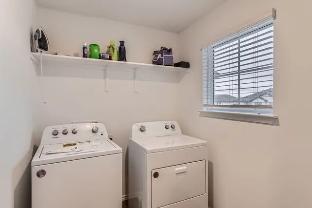 a utility room with dryer and washer