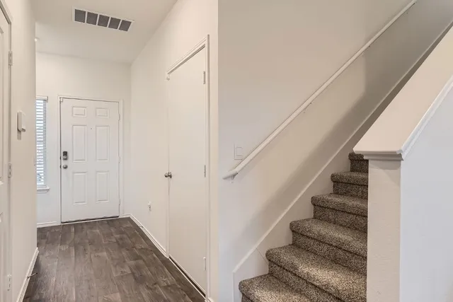 a view of entryway with wooden floor
