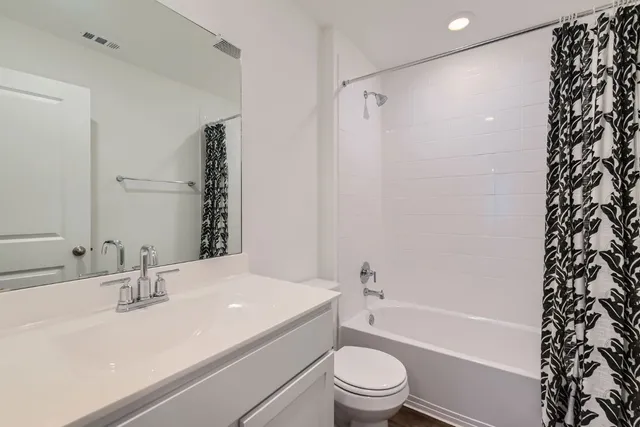 a bathroom with a sink a toilet and a bathtub
