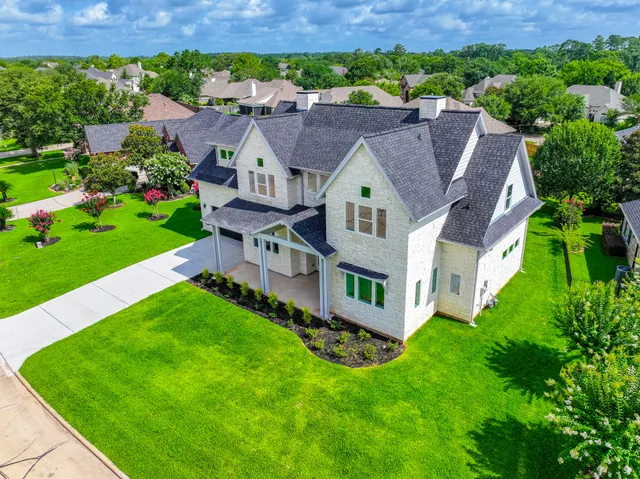 an aerial view of a house with a garden