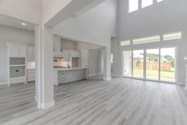 a room with a dresser and mirror