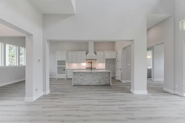 a view of a kitchen with wooden floor