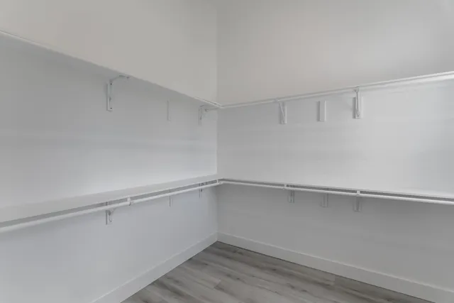 a view of an empty walk in closet