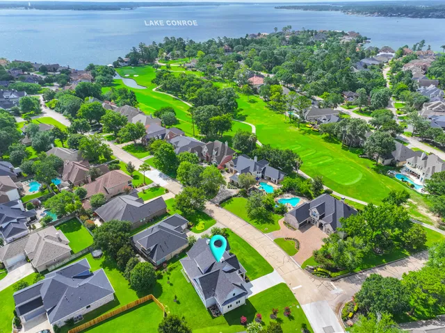 an aerial view of a house with a garden